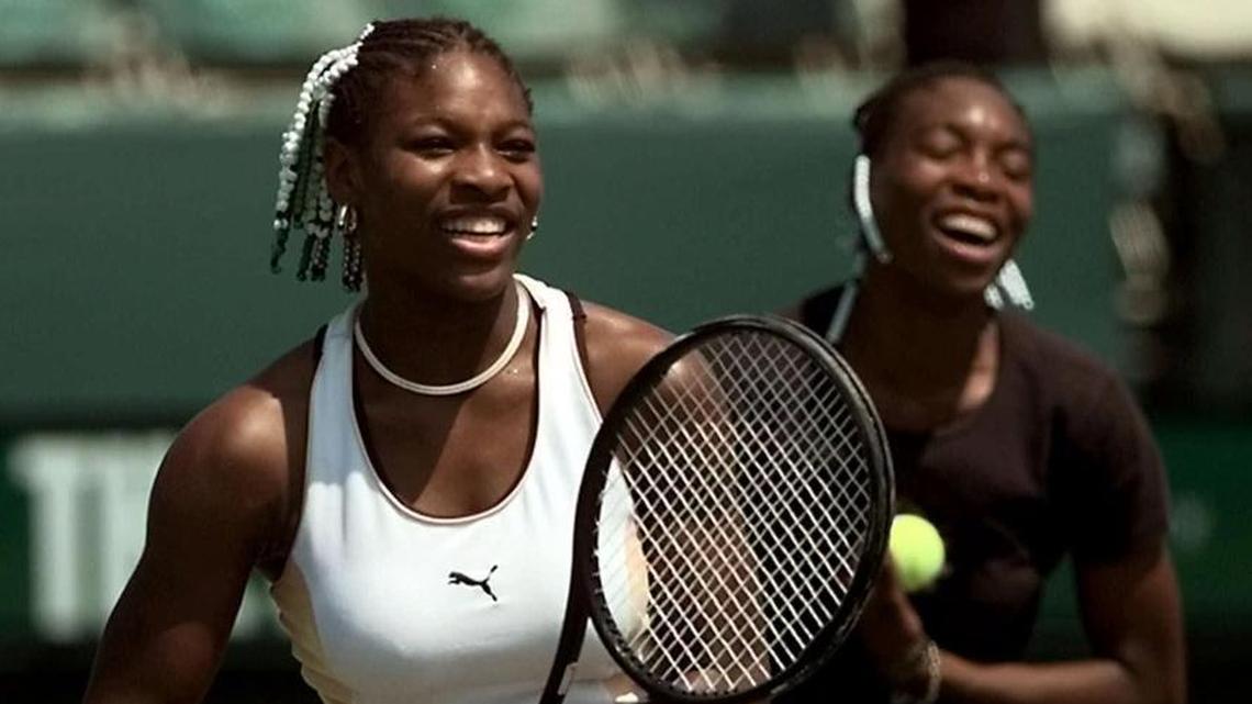 Serena Williams, left, and her sister Venus, right, share a light-hearted moment on the practice court on March 27, 1999, at the Lipton Championship in Key Biscayne. The siblings faced off in the finals.
