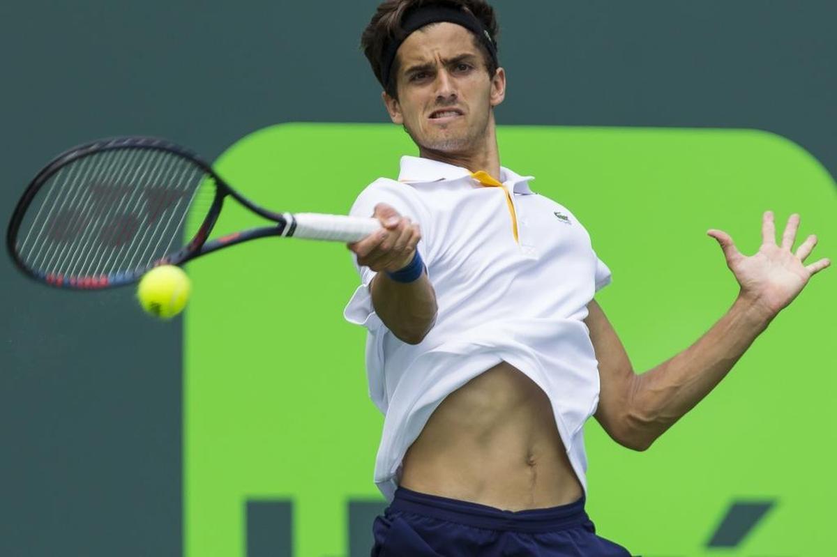 Pierre-Hugues Herbert of France, returns against Taylor Fritz of USA during the Miami Open tennis tournament, Wed., March 21, 2018, in Key Biscayne, Fla.