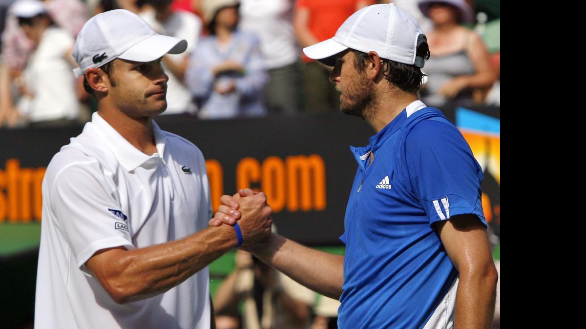 
FILE- In this Jan. 23, 2007, file photo, Andy Roddick, left, is congratulated by Mardy Fish after their quarterfinal match at the Australian Open in Melbourne, Australia. The pair will play doubles together at the BB&T Atlanta Open next month, and Fish is also going to attempt another comeback in singles. 
