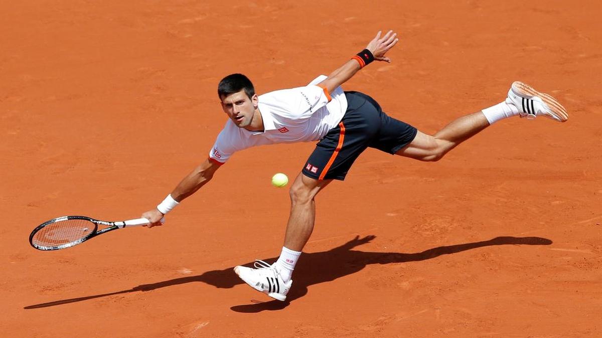 
Serbia's Novak Djokovic returns the ball to Thanasi Kokkinakis of Australia during their third round match of the French Open tennis tournament at the Roland Garros stadium, Saturday, May 30, 2015 in Paris.
