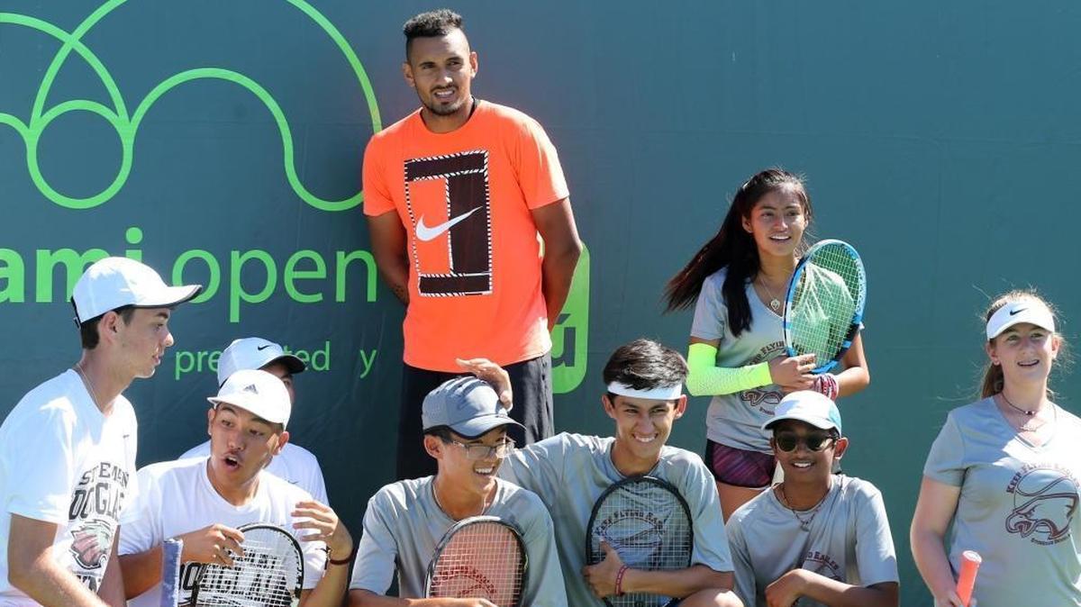 Tennis player Nick Kyrgios with tennis players from Marjory Stoneman Douglas HS at the Miami Open on Key Biscayne, Florida, March 25, 2018.