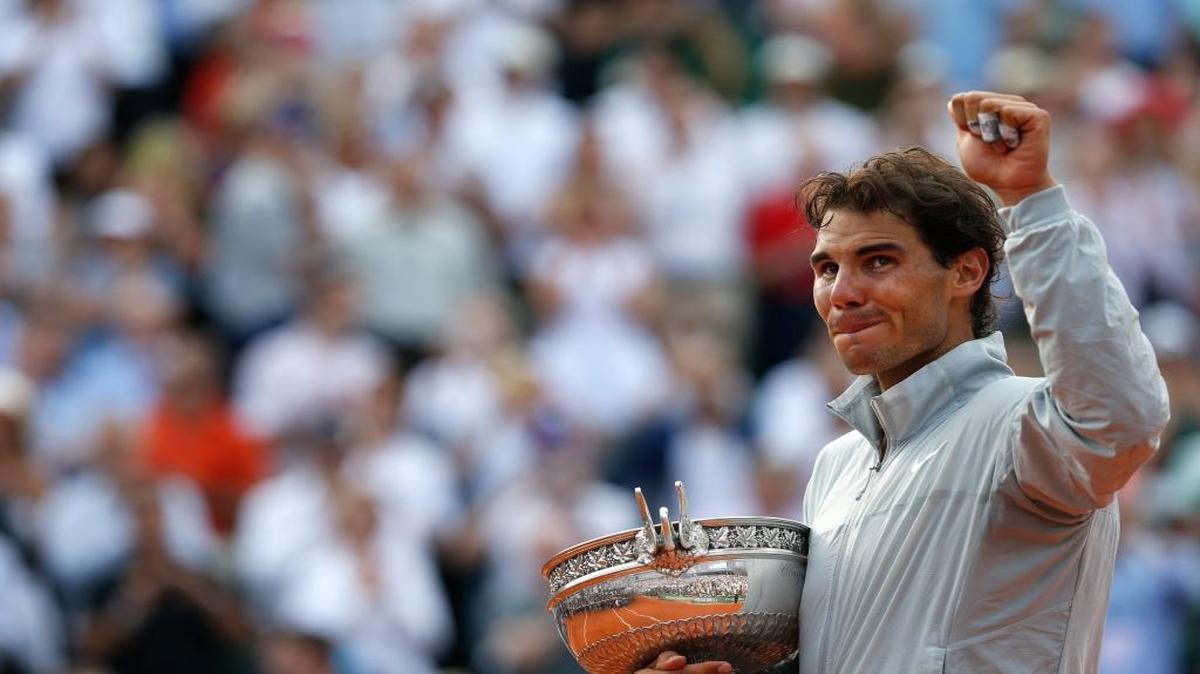 FILE - This June 8, 2014, file photo shows Spain's Rafael Nadal holding the trophy after winning the final of the French Open tennis tournament against Serbia's Novak Djokovic at the Roland Garros stadium, in Paris, France. Nadal appears to be inching closer to finding his old "King of Clay" form.