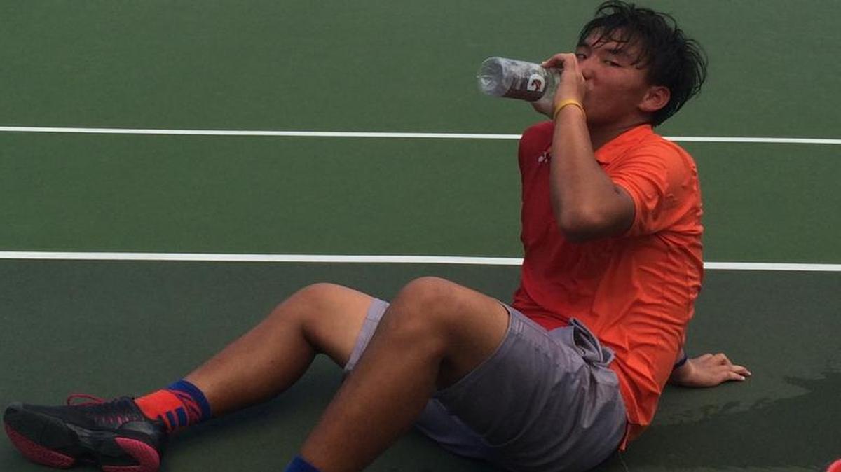Top-seeded Buyun Chaokete of China needs a rest after a three-hour 6-4, 4-6, 7-6 (9-7) Boys 14s semifinal win over Zane Khan of the United States in the Jr. Orange Bowl Tennis Championships.