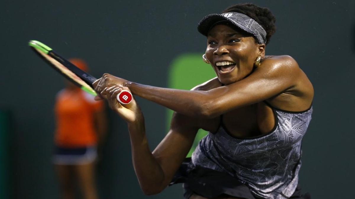 Venus Williams, of United States, returns a shot against Angelique Kerber, of Germany, during their match at Miami Open tennis tournament on Wednesday, March 29, 2017, at Crandon Park in Key Biscayne.