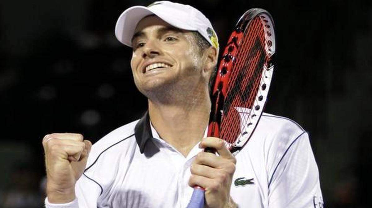 
John Isner, of the United States, reacts after defeating Milos Raonic, of Canada, 6-7 (3), 7-6 (6), 7-6 (5) during the Miami Open early Wednesday, April 1, 2015, in Key Biscayne, Fla. 
