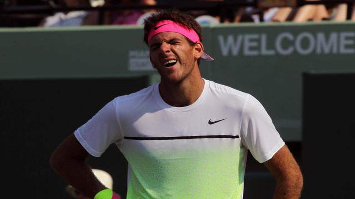 
Argentine Juan Martin del Potro shows a painful face after tweaking his right ankle during his game against Canadian Vasek Pospisil at the Miami Open in Key Biscayne on March 26, 2015. del Potro lost 6-4, 7-6 (7).
