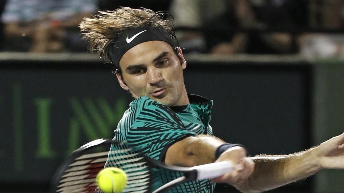 Roger Federer hits to Nick Kyrgios during the men's singles semifinals at the Miami Open tennis tournament, presented by Itau, at Crandon Park Tennis Center in Key Biscayne on March 31, 2017.