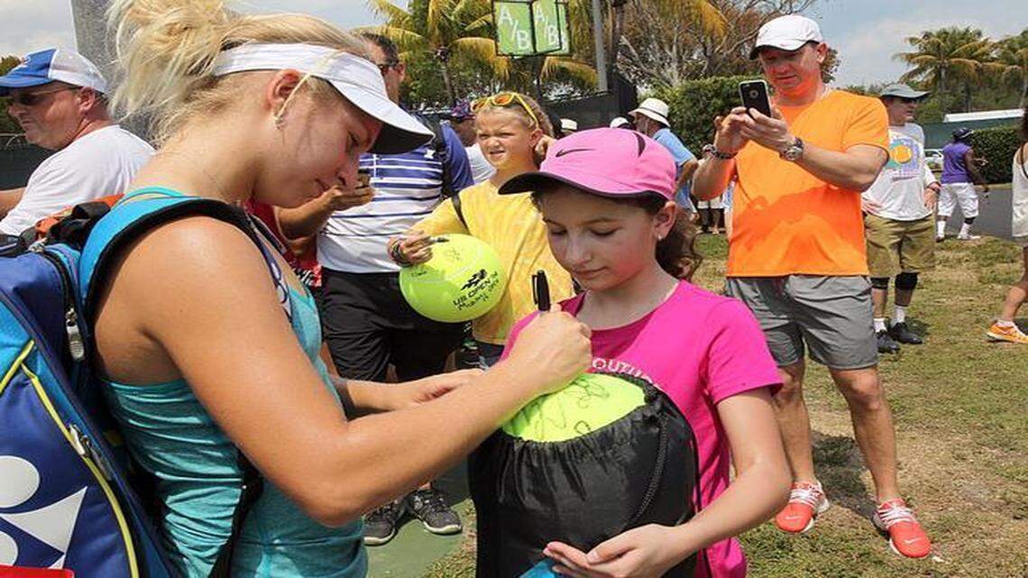 
Daria Gavrilova signs an autograph for Nicole Lisovyy of Philadelphia on Monday at the Miami Open.
