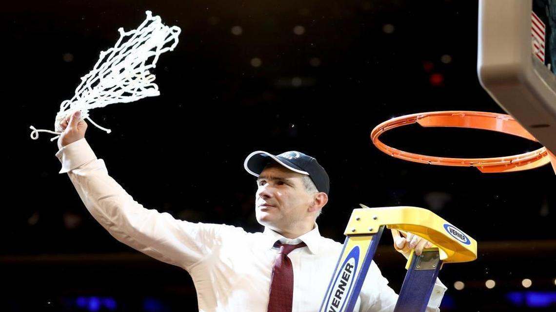 Head coach Frank Martin of the South Carolina Gamecocks celebrates by cutting down the net after defeating the Florida Gators with a score of 77 to 70 to win the 2017 NCAA Men's Basketball Tournament East Regional at Madison Square Garden on March 26, 2017 in New York City.
