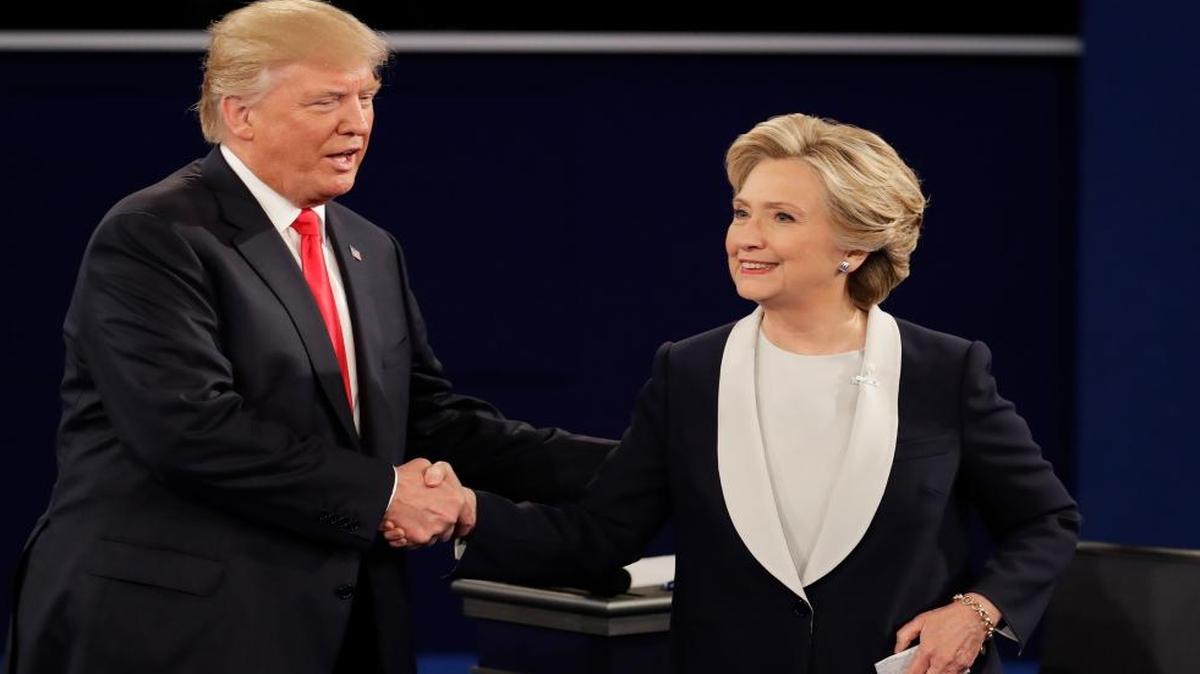 Republican presidential nominee Donald Trump and Democratic presidential nominee Hillary Clinton shake hands after the second presidential debate at Washington University in St. Louis, Sun., Oct. 9, 2016.