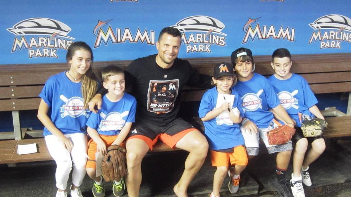 Miami Marlins third baseman Martin Prado poses for a photo with the July honorees of the Very Prado You student athlete (baseball/softball) program in conjunction with the Miami Herald and the Marlins. Kaitlyn Perdomo (Saint Louis Covenant School), Nathan Betz (Calvary Christian Academy), Noah Cantor (North Beach Elementary School), Ayron Diaz (West Hialeah Gardens Elementary School), and Nicholas Pavlou (Herbert A. Ammons Middle School) were recognized for their academics and sportsmanship at a ceremony behind home plate before the Marlins game against the Philadelphia Phillies at Marlins Park. Prado provided an autographed certificate of achievement, four game tickets, food and beverage, parking, and a Very Prado You T-shirt. The honorees also attended batting practice.