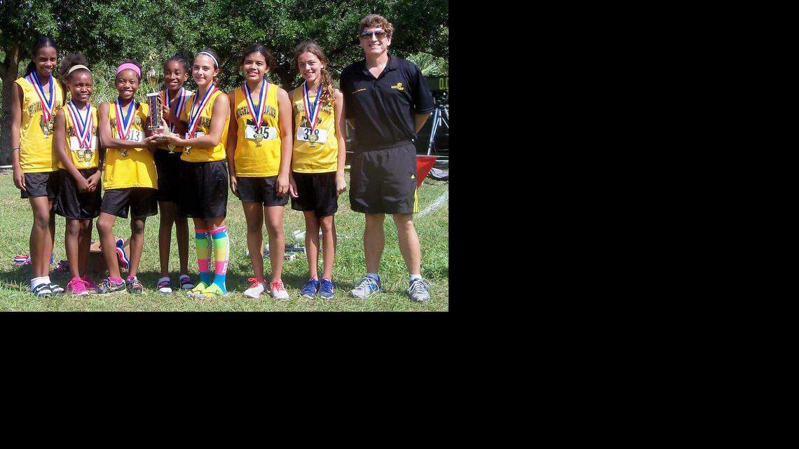 
For the first time in Highland Oaks Middle School history, the school has a county champion in cross-country. The Panthers JV girls won the Miami-Dade County Middle School Championship at Penny and Larry Thompson Park. The record setting champs are Team Captain Vashti Claybrook, Anissa Lespinase-Casimir, Destiny Desrivieres, Shannon Laguerre, Kayla Yuengling, Jamie Galo, Giuliana Moreno and Coach Matt Tomlinson.
