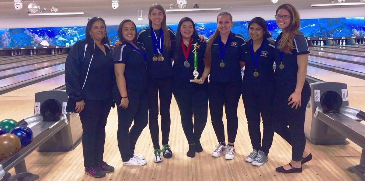 The Ferguson High School girls’ bowling team won the Miami-Dade County Youth Fair Bowling Tournament at Bird Bowl. The champs are from left, Coach Marcela Y. Del Rosario, Melissa Perez, Angela Chapman, Vanessa Perez, Kassandra Buell, Emilia Alvarado, and Gabriela Sanchez. Not pictured Valerie Chapman.