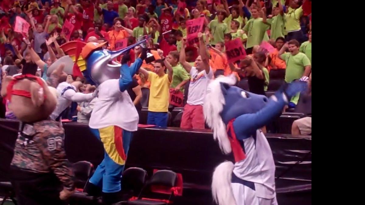 
Billy the Marlin of the MLB Miami Marlins celebrates with the team trophy and fans as he helped the Target Red Team win day one of the 22nd Mascot Games June 19-20 at the Amway Center in Orlando. The Games, presented by Wawa and benefiting New Hope for Kids, featured more than 20 of the top mascots from college and professional sports teams. Stormy of the NHL Carolina Hurricanes was the team captain of the winning Target Red Team, and Champ of the NBA Dallas Mavericks was also part of that victorious team.
