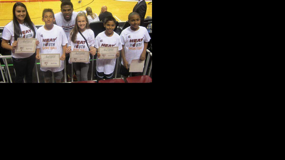 
Miami Heat forward Udonis Haslem, a three-time NBA champion who grew up and lives in Miami, congratulated some of last season’s honorees of the Miami Heat-Miami Herald Academic/Sportsmanship Team Player Program. Nominations are being accepted for this season’s program in conjunction with Gatorade.
