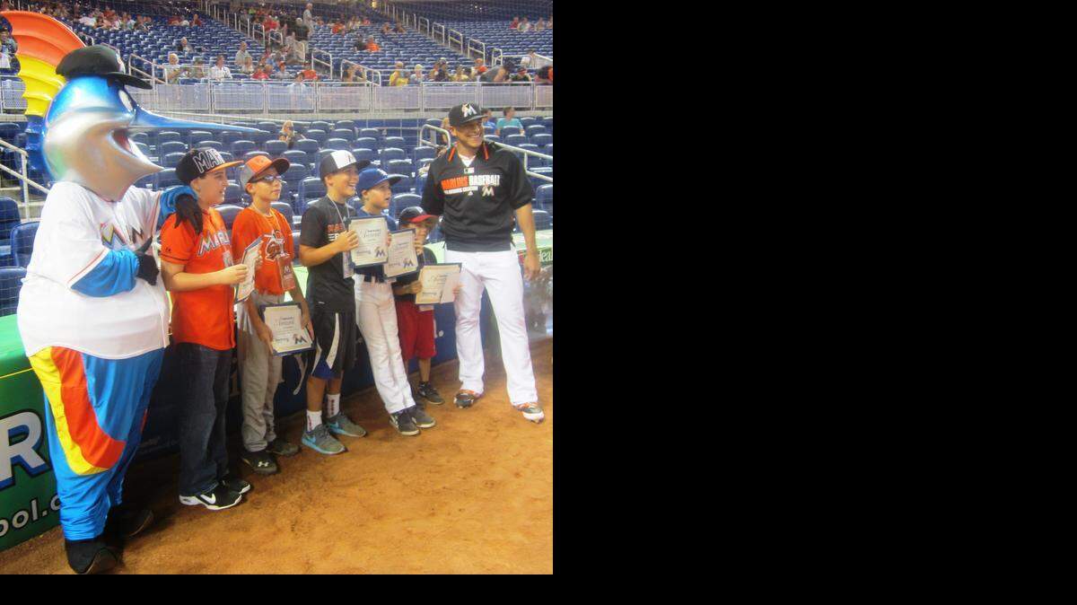 
Miami Marlins pitcher A.J. Ramos and Marlins mascot Billy the Marlin congratulate Gaby Santalo (Conchita Espinosa Academy), Juan Carlos Perez Jr. (Greater Miami Adventist Academy), Aaron Felder (Virginia A. Boone Elementary School), Nate Augusta (Fisher Island Day School) and Daniel Alvarez (King’s Christian School) for being the Miami Marlins/Miami Herald Team Player Honorees for August. They were acknowledged on the field before the Marlins/St. Louis Cardinals game at Marlins Park.
