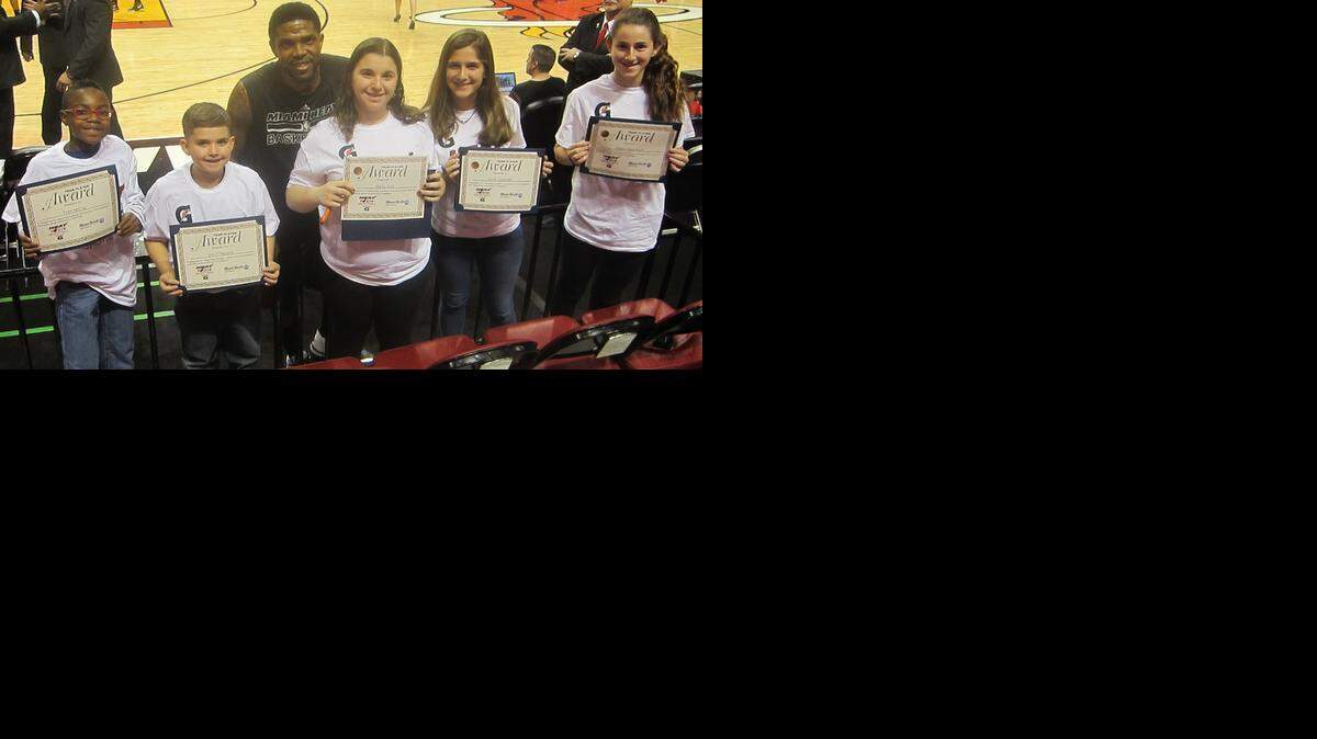 
Miami Heat forward Udonis Haslem congratulates (from left) Tyler McCray (Frank C. Martin K-8 International School), Eric Villanueva (John I. Smith K-8 Center), Bailey Koch (Falcon Cove Middle School), Arella Zambrano (Conchita Espinosa Academy) and Ahava Greenbaum (Hochberg Preparatory School) for being the January honorees of the Miami Heat-Miami Herald Academic & Sportsmanship Team Player program in conjunction with Gatorade. The standout student athletes were honored before the Heat’s game against the Milwaukee Bucks at the AmericanAirlines Arena.

