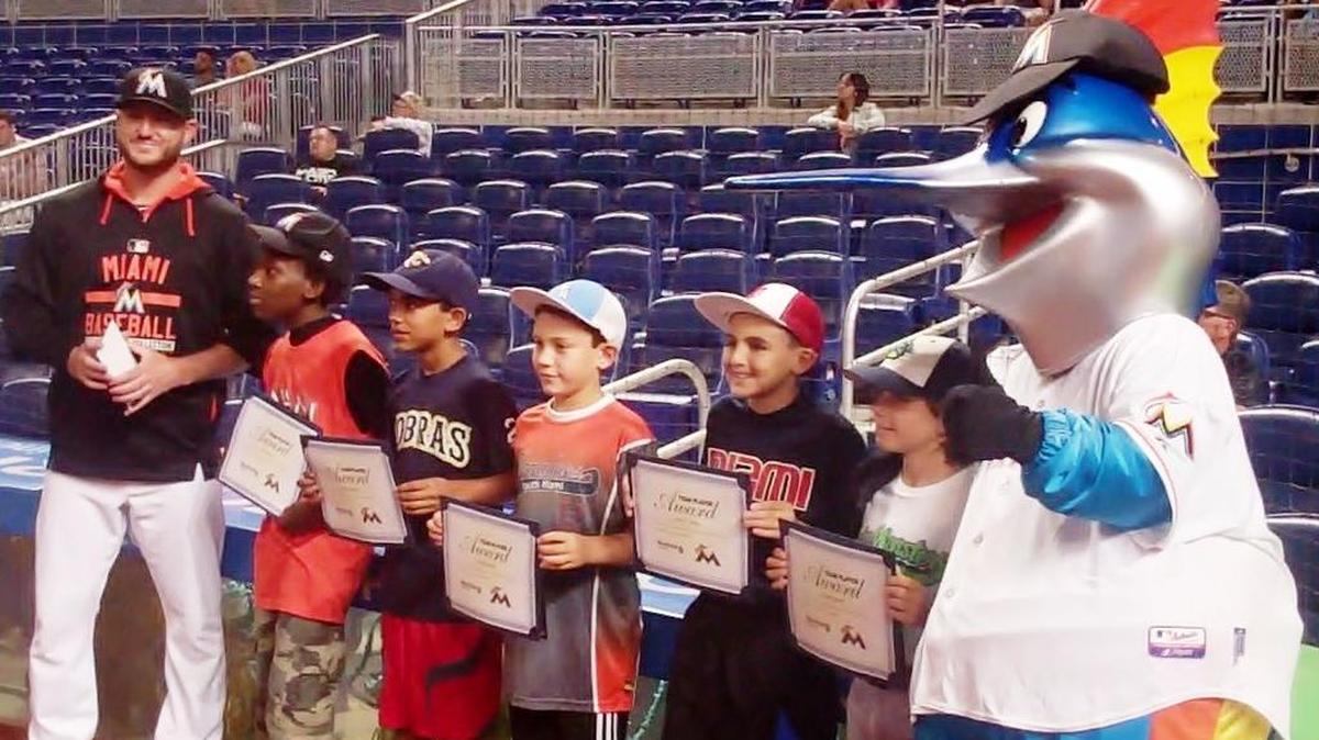 
Miami Marlins reliever Bryan Morris and Billy the Marlin congratulate Javen Harris (Florida International Academy), Rocco Nappi (Pembroke Pines Charter Middle School), Francisco Soto (St. Thomas the Apostle Catholic School), Adrien J. Reina (Our Lady of the Holy Rosary-St. Richard School) and David Tamen (North Beach Elementary School) for being for the July honorees of the Miami Marlins/Miami Herald Team Player Program. The standouts were recognized during a ceremony before the Marlins game against the Washington Nationals at Marlins Park.
