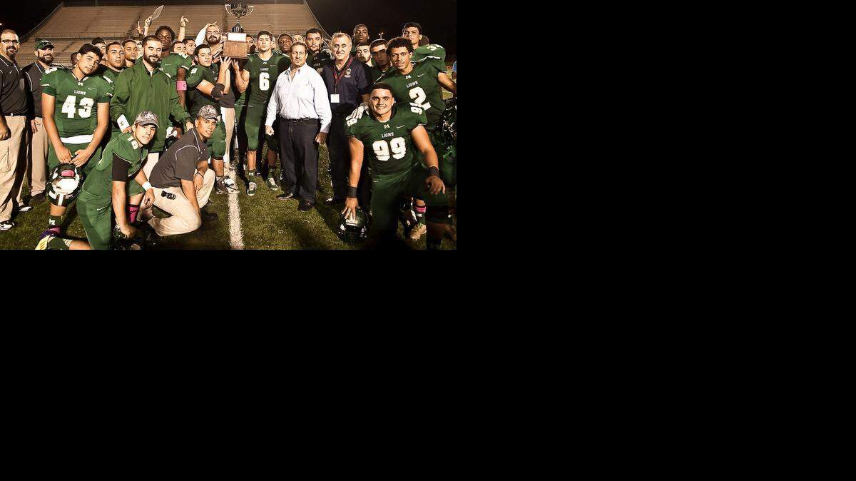 
The Mater Academy football team celebrated a victory over Westland Hialeah High School in the first “Commissioners Cup,” sponsored by Miami-Dade County Commissioners Jose “Pepe” Diaz (District 12) and Esteban Bovo Jr. (District 13) at Traz Powell Stadium. Diaz (pictured with Mater) won bragging rights as Mater is in his district and Westland Hialeah in Bovo’s district.

