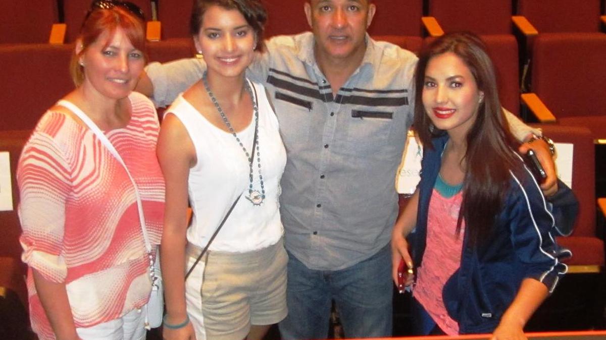 Told by doctors as a youth that she would never walk again, a determined and inspirational Jennifer Chang (right) overcame that diagnosis and is now a member of the world-renowned Miami Dolphins cheerleaders. She and her family (pictured - mom, sister, dad) defected from Cuba to Miami 11 years ago. A nursing student, Chang, 20, is a Palmetto High School and Miami Dade College graduate.