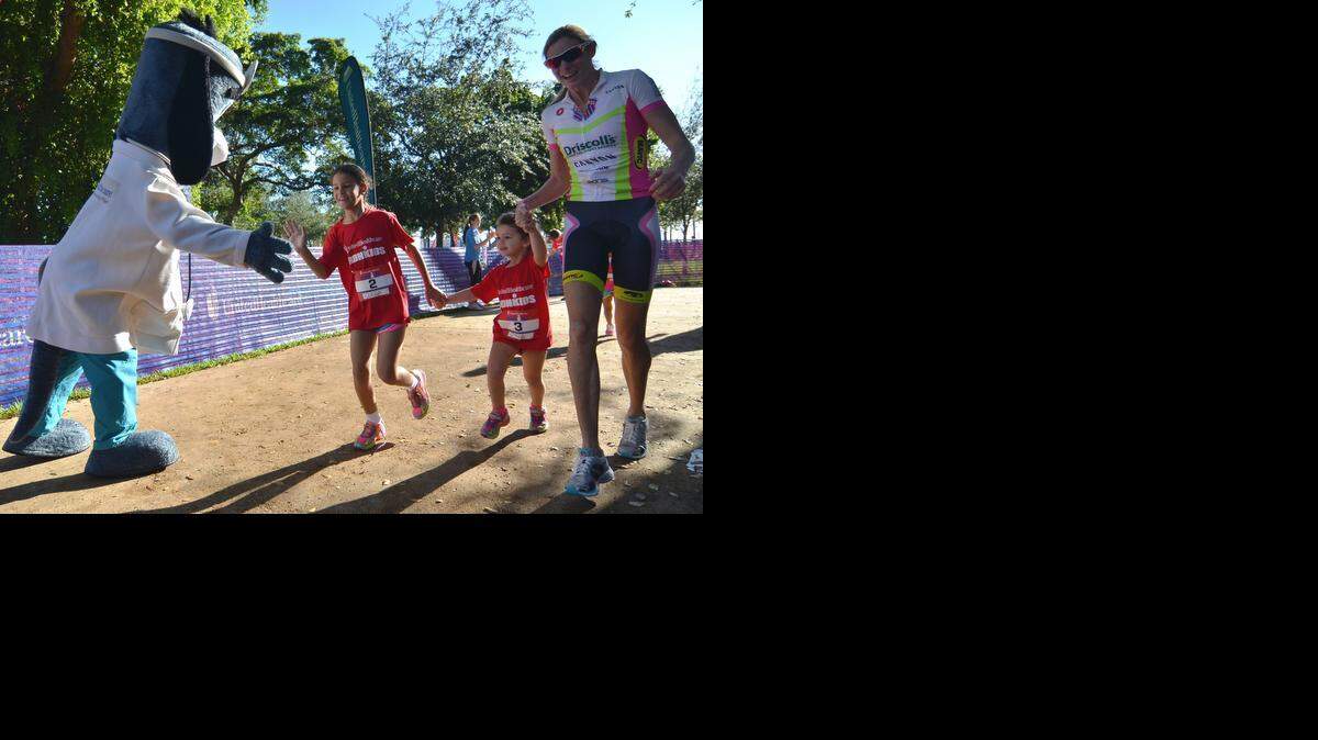 
UnitedHealthcare mascot Dr. Health E. Hound and Leanda Cave, a four-time World Triathlon champion, help local youth cross the finish line at the inaugural UnitedHealthcare IRONKIDS Miami Fun Run at Bayfront Park.
