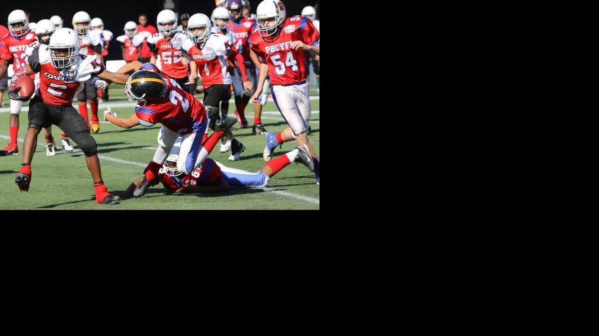 
The Key West All-Stars played the Palm Beach County All-Stars in the 140s weight class of the Orange Bowl Youth Football Alliance Championships, presented by Sports Authority, at Alfonso Field at FIU Stadium in Miami.
