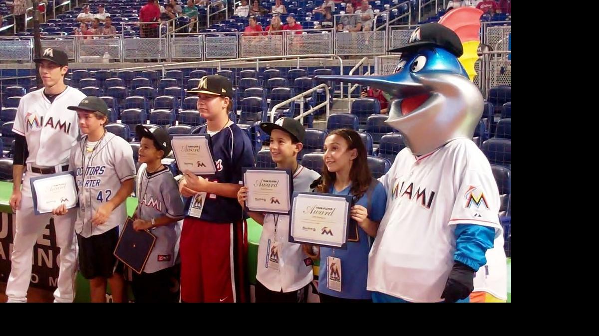 
TOP HONOREES: Miami Marlins outfielder Christian Yelich (left) and Billy the Marlin (right) congratulate Charles Calli (Doctors Charter School), Damani Downs (Maddie Ives Elementary School), Connor Goodman (Miami Country Day School), Mason Koczwara (Ruth K. Broad Bay Harbor K-8 Center) and Sofia Rodriguez (Springview Elementary School) during a ceremony for them as the June honorees of the Miami Marlins/Miami Herald Team Player Program at Marlins Park. These standout student athletes were recognized for their academics, community involvement and sportsmanship, before the Marlins game against the St. Louis Cardinals.
