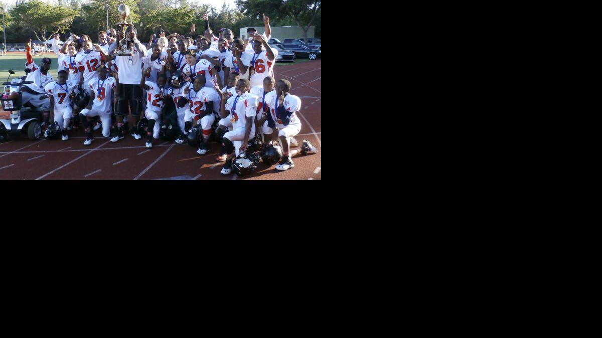 
The Coconut Grove Titans won the Greater Miami South Florida Pop Warner Junior Midget Division II Super Bowl during the Sean Taylor Classic at North Miami Athletic Stadium.
