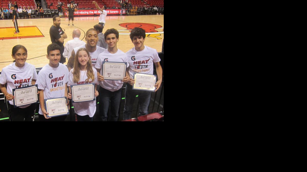 
Miami Heat forward Michael Beasley congratulated (from left) Maria Alvarez (Miami Country Day School), Ulises Hernandez III (Our Lady of the Lakes School), Emily Davidovic (Hochberg Preparatory School), Nicolas Aixala (Conchita Espinosa Academy), and Sebastian Vidal-Casanova (St. Patrick School) for being the Miami Heat/Miami Herald March Academic/Sportsmanship Team Players in conjunction with Gatorade at the AmericanAirlines Arena. They were honored on the court before the Heat’s win against the Portland Trailblazers.
