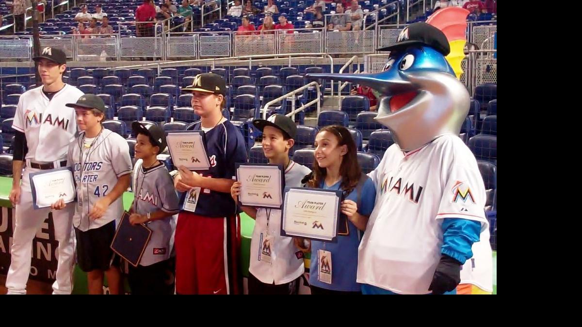 
Miami Marlins outfielder Christian Yelich (left) and Billy the Marlin (right) congratulate Charles Calli (Doctors Charter School), Damani Downs (Maddie Ives Elementary School), Connor Goodman (Miami Country Day School), Mason Koczwara (Ruth K. Broad Bay Harbor K-8 Center) and Sofia Rodriguez (Springview Elementary School) during a ceremony for them as the June honorees of the Miami Marlins/Miami Herald Team Player Program at Marlins Park. These standout student athletes were recognized for their academics, community involvement and sportsmanship, before the Marlins game against the St. Louis Cardinals.
