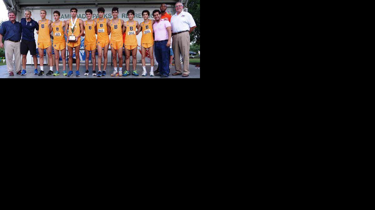 
The Belen Jesuit Prep High School boys’ varsity team won the Mayor’s Cup for finishing first at the Miami-Dade County Youth Fair Cross-Country Invitational at Larry and Penny Thompson Park in southwest Miami-Dade County. Pictured are Frank Balzebre, Intergovernmental Liaison at Office of Miami-Dade County Mayor Carlos A. Gimenez; Belen Head Coach Frankie Ruiz, Bruno Zayas, Nicolas Roca, Ryan Rodriguez, Jaime Lopez, Chris Garcia, Antonio Montadas, Rodrigo Bustamante, Jorge Gomez, Belen Assistant Coach Rene Medina, Miami-Dade County Youth Sports Development Manager Chris Evans and Miami-Dade County Youth Fair President/CEO Robert Hohenstein.
