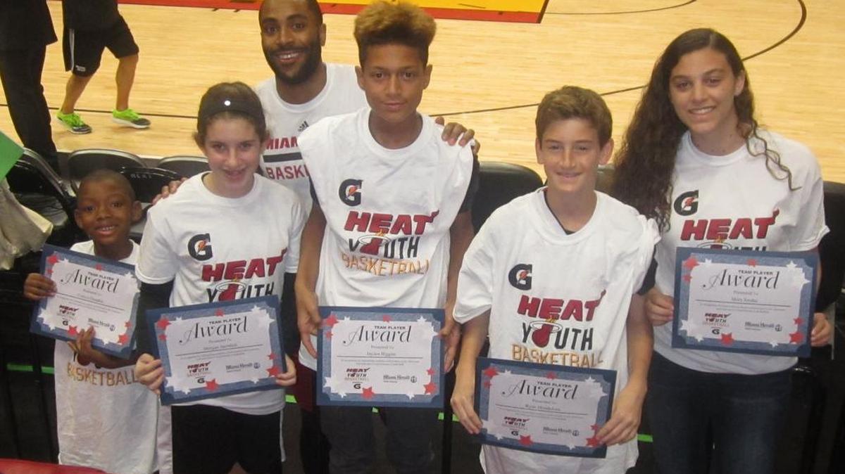 Miami Heat guard Wayne Ellington congratulates Corbyn Dauphin (Cutler Ridge Elementary School), Morgan Sternlieb (Omni Middle School), Jayden Higgins (Gulliver Middle School), Ryan Mendelson (Miami Country Day School), and Shira Sredni (Scheck Hillel Community School) for being the Miami Heat March Academic/Sportsmanship Team Player Honorees in partnership with Gatorade and The Miami Herald. They were recognized before the Heat/Philadelphia 76ers game at the AmericanAirlines Arena.
