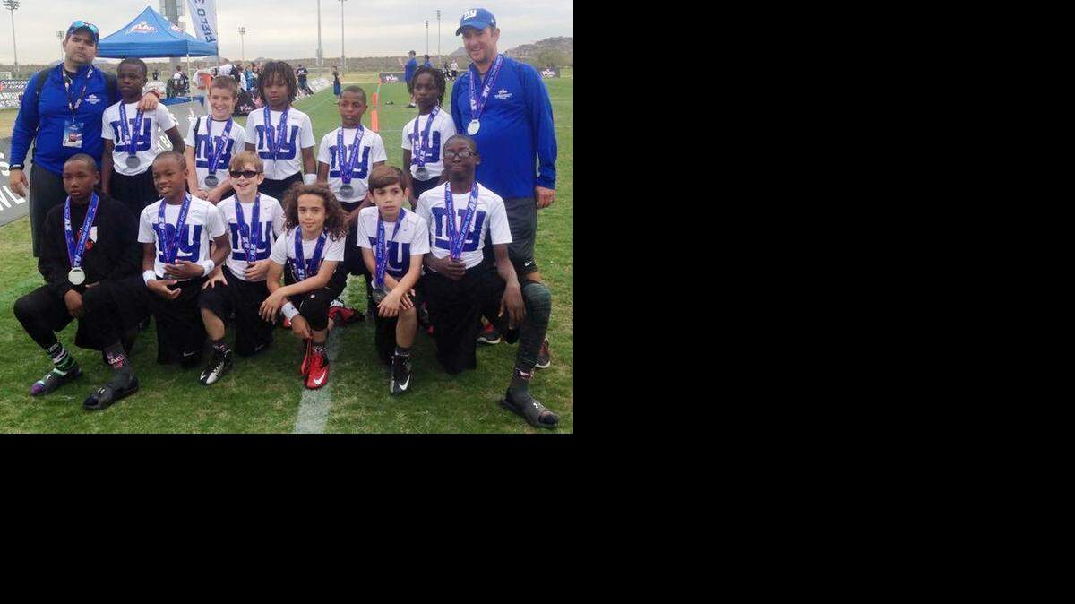 
R.Y.A.N. Football from Miami won the 10U division for the second consecutive year at the NFL FLAG Championships during Super Bowl XLIX Week in Phoenix. The national champs are front from left, Yavis Ferrell, Antino Smith, Nicholas Sosa, Jonjon Delgado Nicholas Sosa, Floyd Ridgeway; back, Coach Rudy Fernandez, Travios Lathan, Carson Haggard, Dedrick Browder, Matthew Boston, Kelvon Durham, and Coach Mike Haggard. Not pictured are Johan Betancourt and Patrick Webb. (CLICK ON ARROWS FOR MORE PHOTOS)

