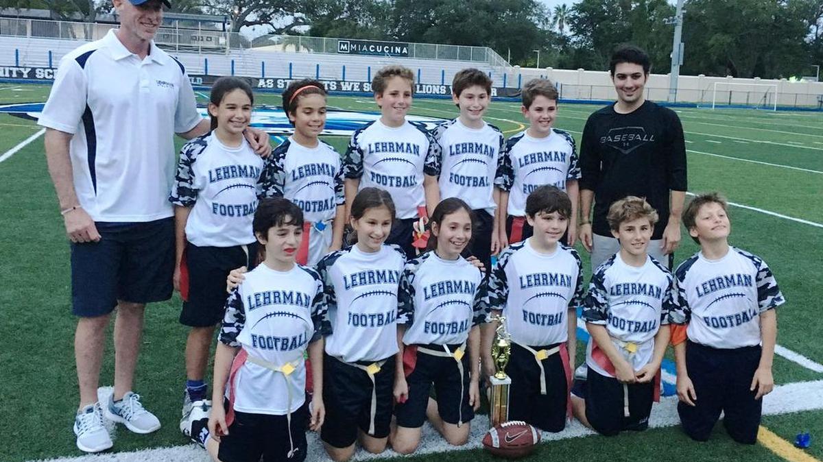 The Lehrman Community Day School 5th grade flag football team won the Jewish Athletic League Championship, besting other Jewish day schools in Miami-Dade and Broward counties. The Lions won as fourth graders in the 4th grade level last season. The repeat champs are front from left, Riley Rozencwaig, Allison Podvin, Rebecca Kapiloff, David Brankovic, QB Brody Minick, Izzi Lieberperson; back, Coach Aaron Corliss, Ella Gilderman, Ryan Bienstock, David Abramowitz, Sammy Goldstein, Ryan Weisburd, and Assistant Coach Eddie Alvarez.
