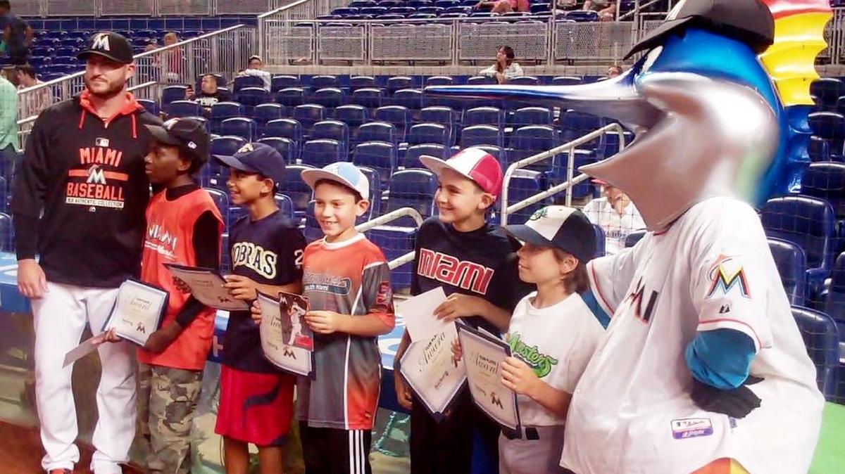 
MARLINS HONOREES: Miami Marlins reliever Bryan Morris and Billy the Marlin congratulate Javen Harris (Florida International Academy), Rocco Nappi (Pembroke Pines Charter Middle School), Francisco Soto (St. Thomas the Apostle Catholic School), Adrien J. Reina (Our Lady of the Holy Rosary-St. Richard School) and David Tamen (North Beach Elementary School) for being for the July honorees of the Miami Marlins/Miami Herald Team Player Program. The standouts were recognized during a ceremony before the Marlins game against the Washington Nationals at Marlins Park.
