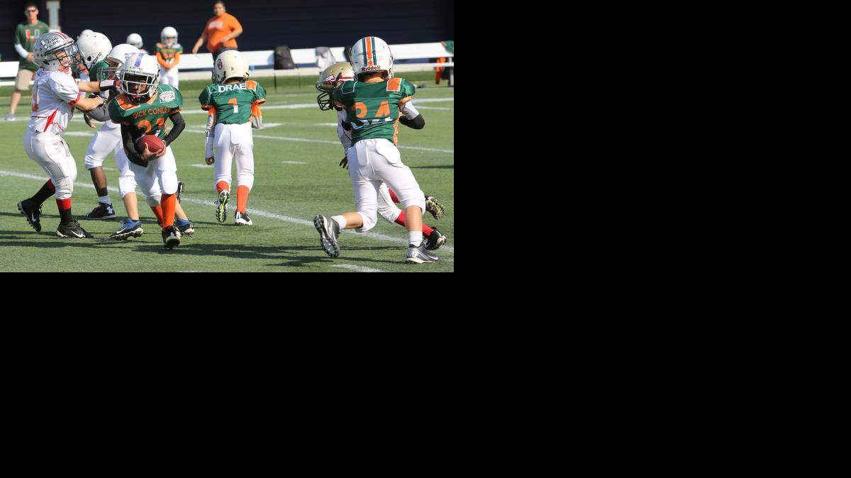 
The (Homestead) Dick Conley All-Stars played the West Boynton All-Stars in the 85s weight class of the Orange Bowl Youth Football Alliance Championships, presented by Sports Authority, at Alfonso Field at FIU Stadium in Miami.
