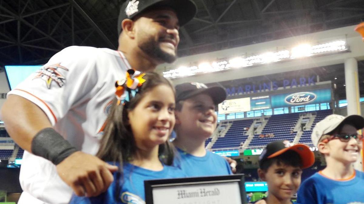 Miami Marlins catcher Tomas Telis during the ceremony to recognize the August honorees of the Very Prado You student athlete (baseball/softball) program in conjunction with the Miami Herald and the Marlins at Marlins Park. Pictured from left, honorees Isabella Pavlou (Calusa Elementary School), Nicholas Neglia (North Hialeah Elementary School), Parker Jelke (Cushman School), and Jacob Gaynor (Nautilus Middle School). Not pictured Honoree Dovid Budwick (Rabbi Alexander S. Gross Hebrew Academy).