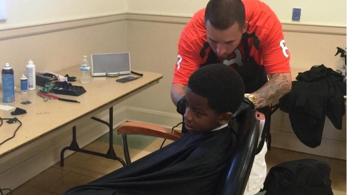 
GIVING BACK: Arthur Pique, head coach of the Suniland Sundevils 8U football team, gave back to the community by hosting the inaugural Education First Back to School Drive. He and four other barbers donated free back to school haircuts to kids at Suniland Park in Pinecrest.
