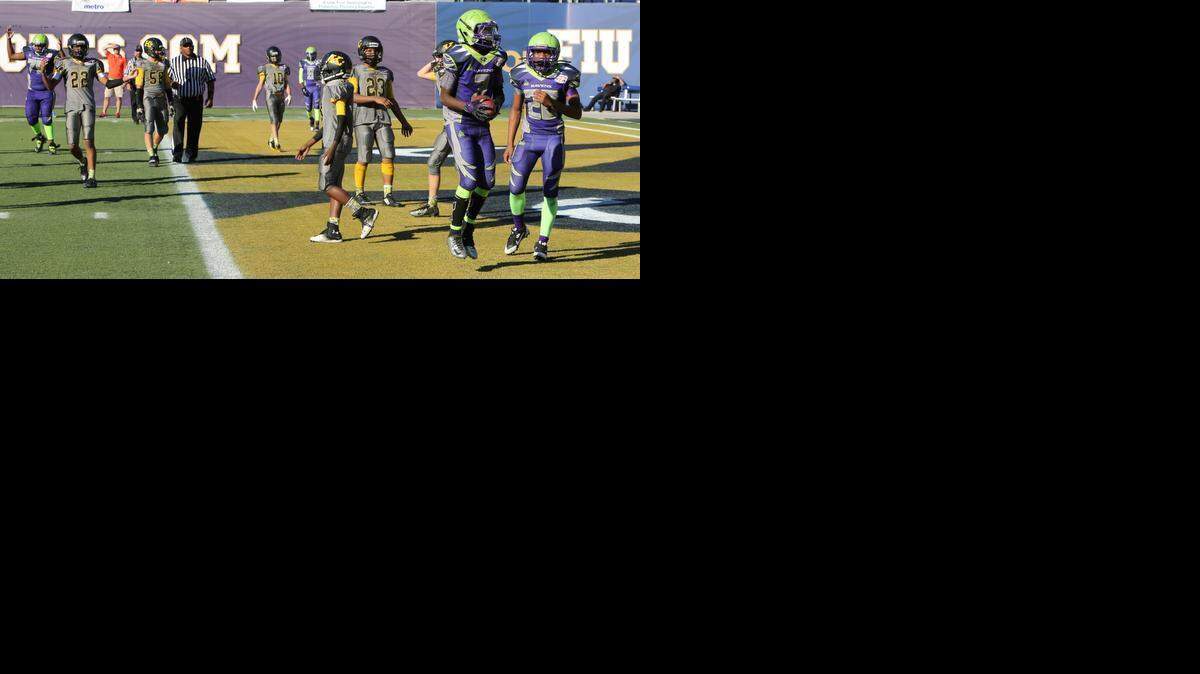 
The Miami Gardens Ravens (FYFL) beat the Kendall Boys & Girls Club Kolts (MDXYFL) in the 13U (150s) Division to win the Orange Bowl Youth Football Alliance Championship, presented by Sports Authority, at Alfonso Field at FIU Stadium in Miami.
